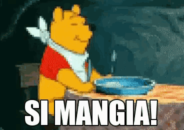 winnie the pooh is sitting at a table with a plate of food and the words si mangia above him