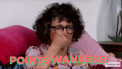 a woman with curly hair and glasses is sitting on a pink couch with the words points wankers written on the bottom