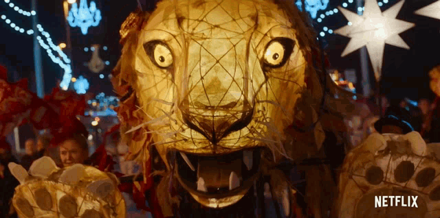 a netflix ad shows a large lion statue