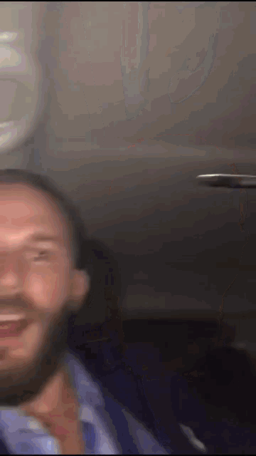 a blurry photo of a man with a beard