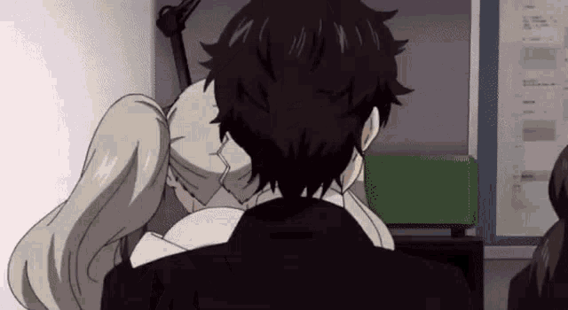 a man and a woman are kissing in a room . the woman is wearing a mask .