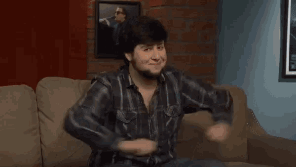 a man sitting on a couch pointing at a map of china with the word china above him