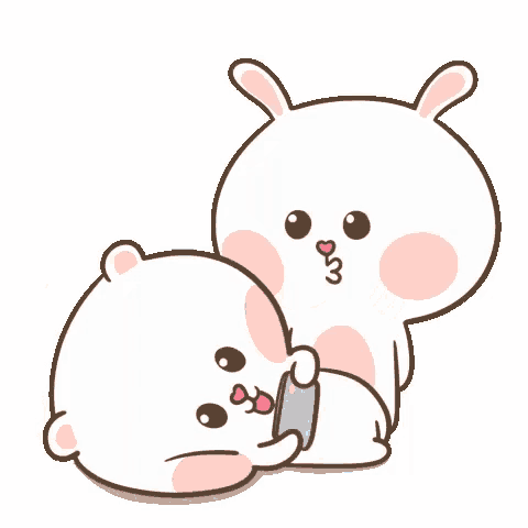 a couple of rabbits are sitting next to each other with hearts around them .