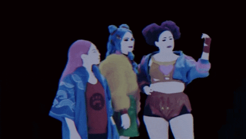 three women are standing next to each other with one wearing a shirt that says ' sd ' on it