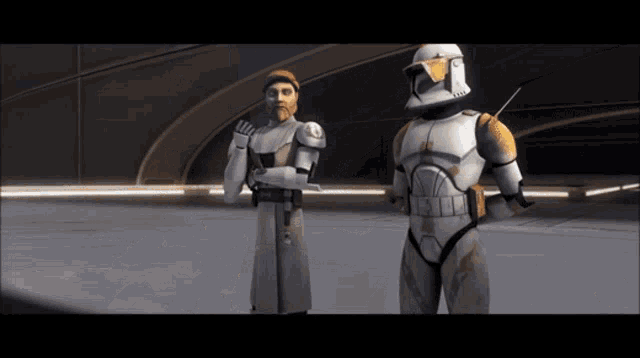 two clone troopers standing next to each other with one wearing a helmet that says ' commander ' on it