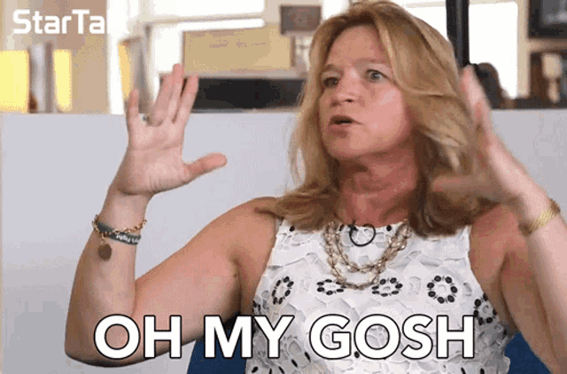a woman says oh my gosh in front of a sign that says starta