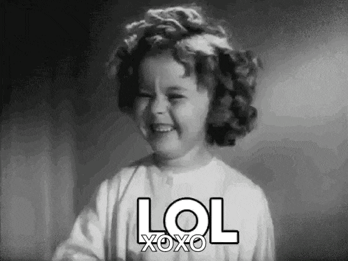 a little girl is laughing in a black and white photo with the words lol xoxo .