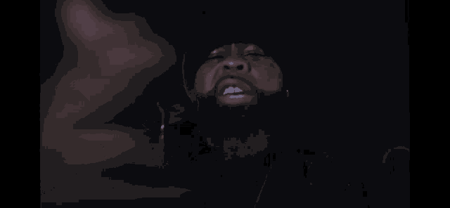 a blurred image of a person 's face in the dark