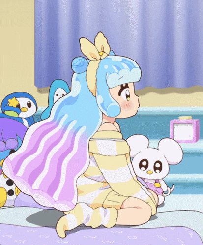 a cartoon girl with blue hair is sitting on a bed
