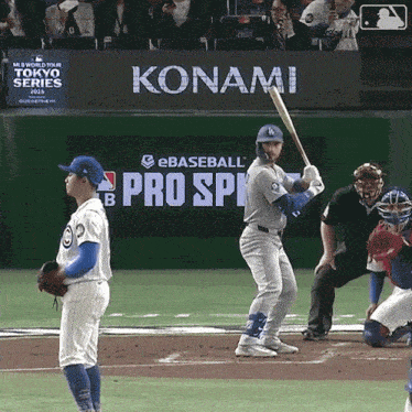 a baseball player is getting ready to bat in front of a konami sign