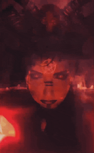 a drawing of a demon with a pentagram on his face