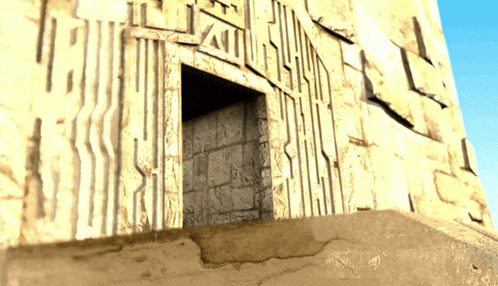 a very old building with arabic writing on the side