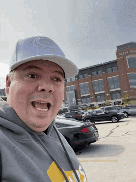 a man wearing a hat that says green bay