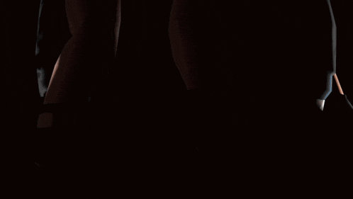 a silhouette of two people standing next to each other