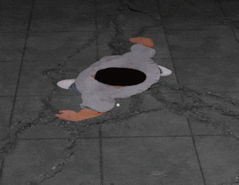 a person laying on the floor with a hole in the middle of their head