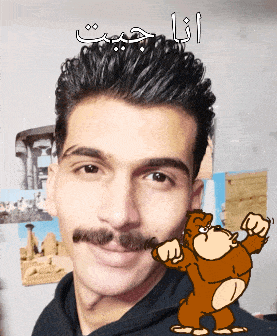 a man with a mustache is smiling with a cartoon gorilla in the background