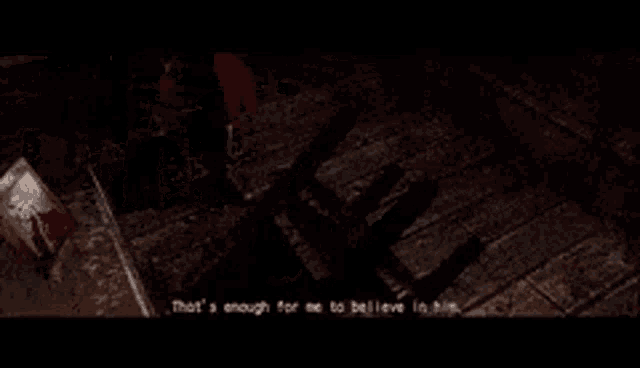 a man is standing next to a chair in a dark room and talking to another man .