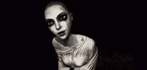 a cartoon character with a shaved head and green eyes is standing in a dark room and looking at the camera .