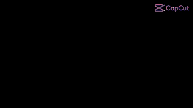 a close up of a pink cartoon character 's eyes in a dark room .
