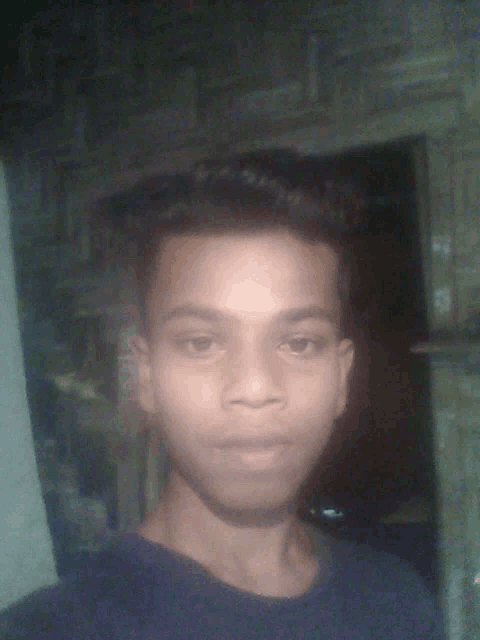 a young man taking a selfie with a blurred background