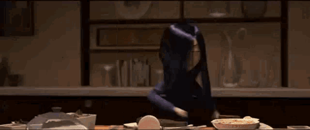 a cartoon character is standing in front of a table with bowls of food .