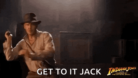 a man in a hat is holding a gun in his hand and says `` get to it jack '' .