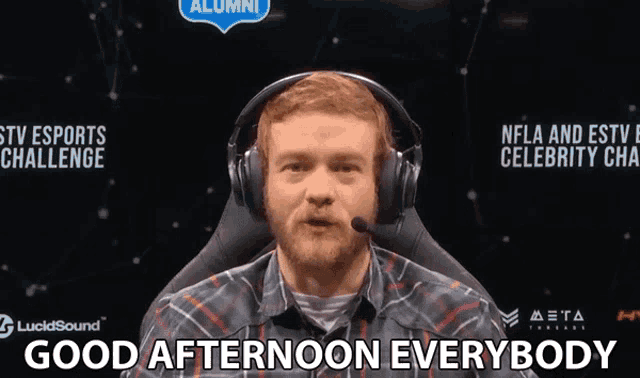 a man wearing headphones with the words good afternoon everybody below him