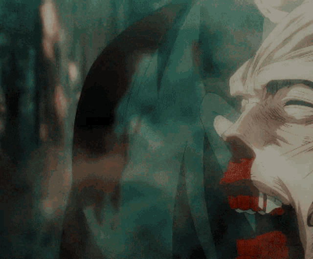 a close up of a person 's face with blood coming out of their mouth