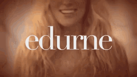a woman is smiling with the word edurne in the background