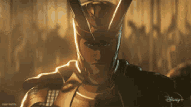a close up of a person wearing a helmet with horns on it