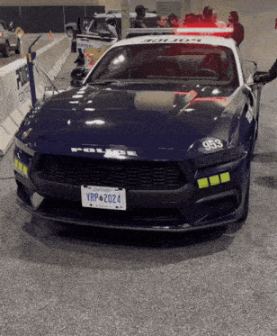 a blue police car with a license plate that says yrp2024
