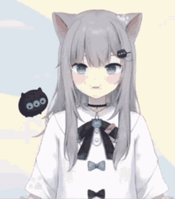 a girl with cat ears and blue eyes is wearing a white shirt and a black bow tie .
