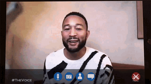 a man is on a video call with #thevoice