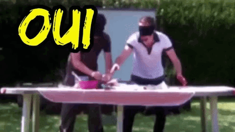 two men are playing a game with the word oui on the bottom