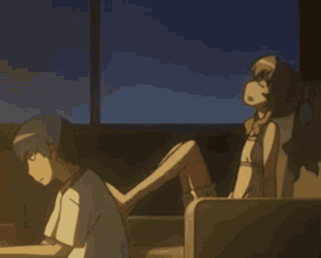 a boy and a girl are sitting next to each other in a room