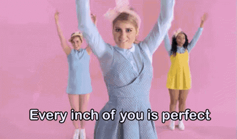 a woman in a blue dress is dancing with a group of girls .