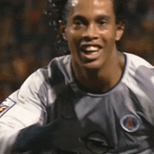 a close up of a man wearing a soccer jersey