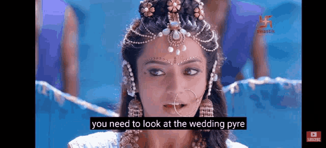 a woman is wearing a wedding dress and jewelry and says you need to look at the wedding pyre