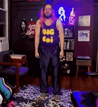 a man wearing a tank top that says big boi on it
