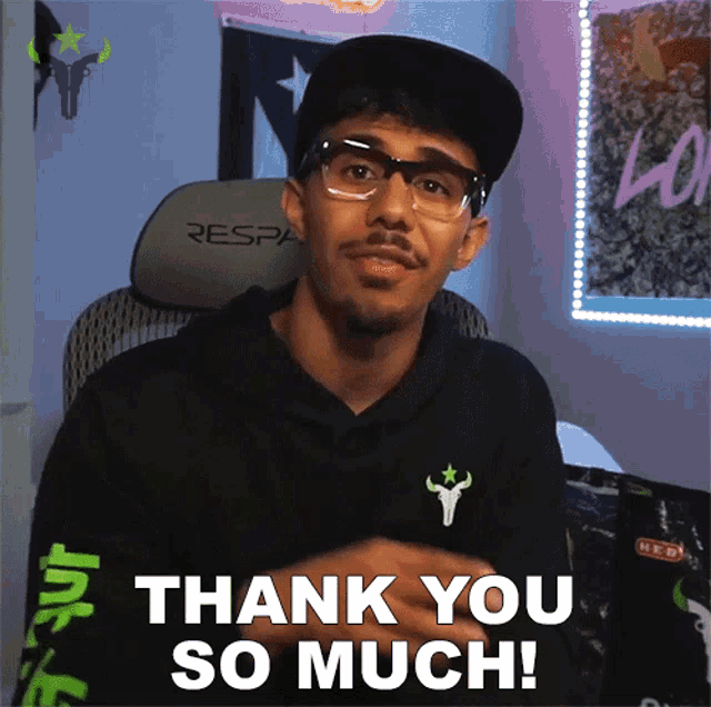 a man wearing glasses and a hat is saying thank you so much