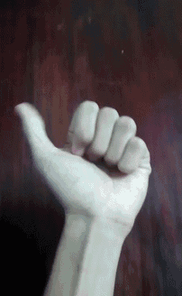 a close up of a person 's hand with their fist up