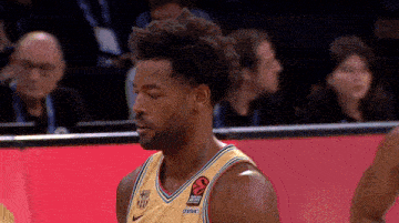 a basketball player wearing a jersey that says ' fcb ' on the front