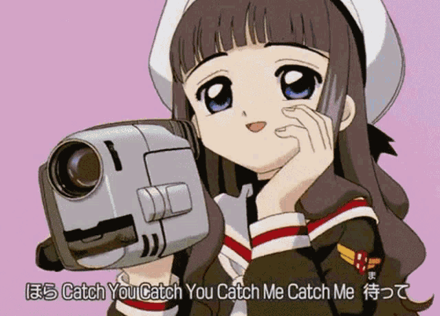 a girl holding a video camera with the words " catch you catch you catch me catch me " on the bottom