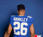 a football player wearing a blue jersey with the name barkley on the back