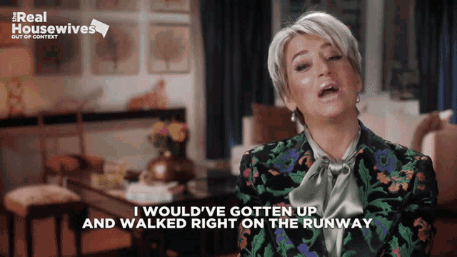 a woman in a floral jacket says i would ve gotten up and walked right on the runway