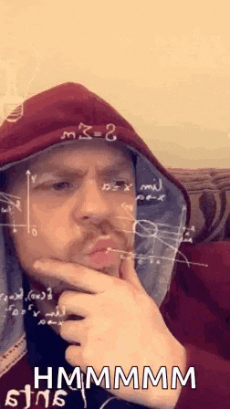 a man in a hoodie is making a funny face with a mathematical formula on his forehead .