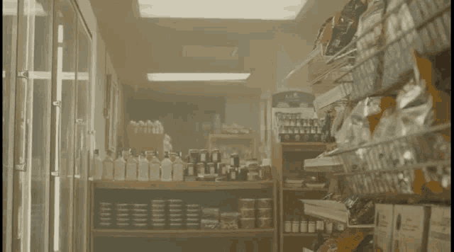 a grocery store aisle with a sign that says ' a & w ' on it