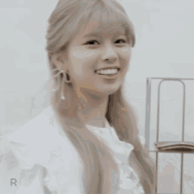 a girl with a heart in a speech bubble with the letter r