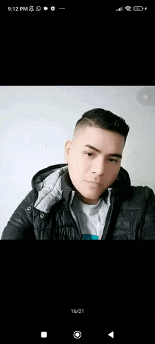a man in a black jacket is taking a selfie