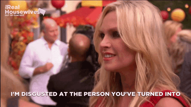 a woman says " i 'm disgusted at the person you 've turned into " in front of a group of people